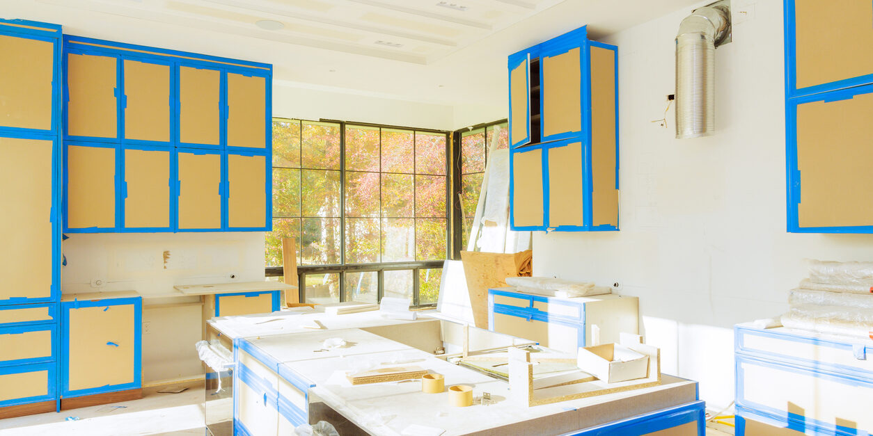 Assembling of white kitchen cabinets in a home improvement project